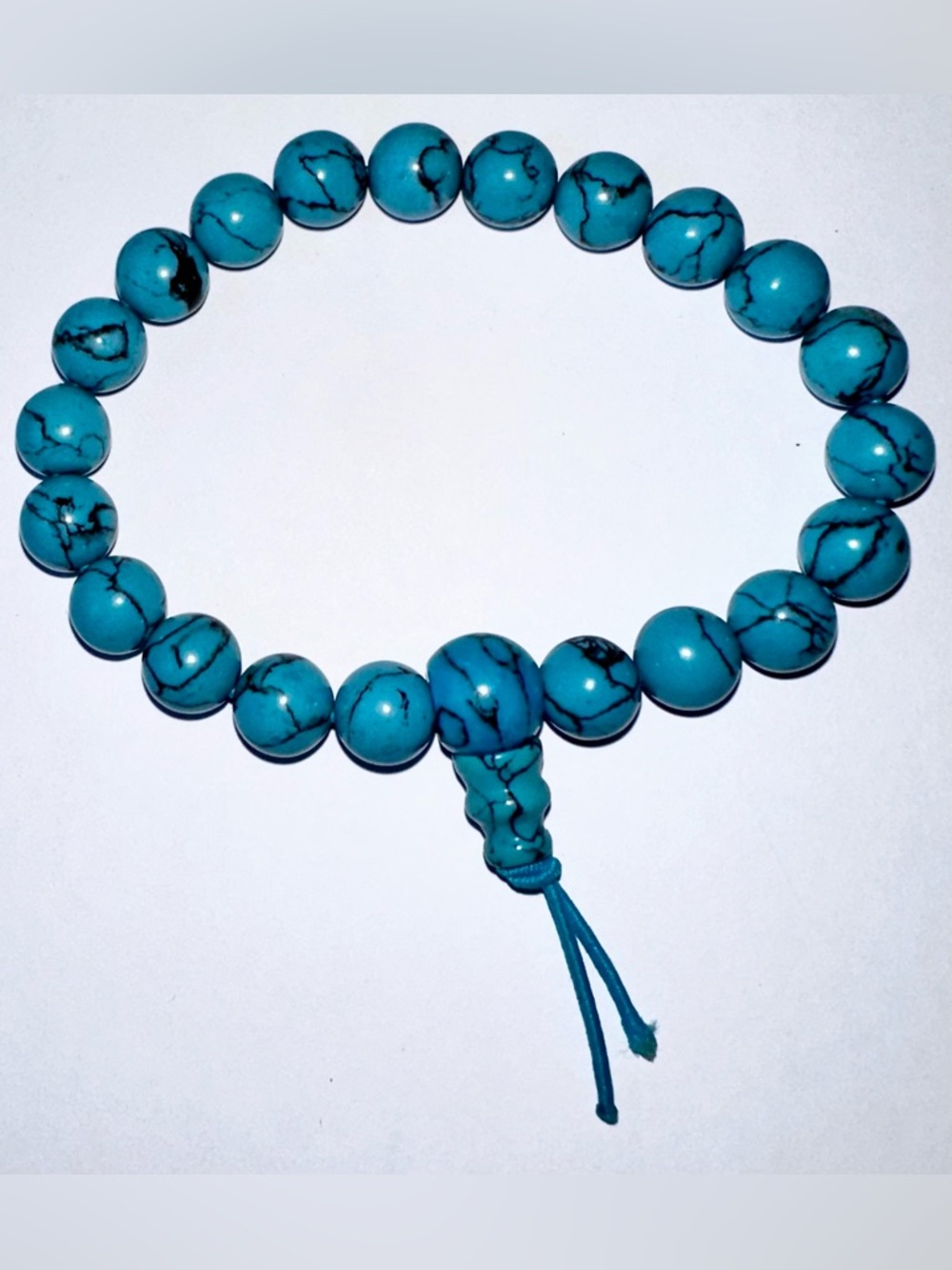 Vintage Avon Turquoise Blue Beaded Stretch Bracelet with Knot Tassel